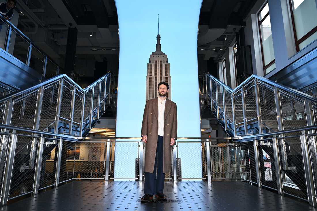 Charlie Vickers wears the Heron's Ghyll Brown Check Double Breasted Wool Overcoat to the Lord of the Rings: Rings of Power photocall.