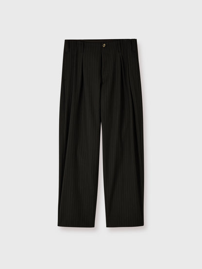 Flat lay of men's Lavelle Inverted Pleat Trousers in black wool with a grey chalk stripe showing the wide leg silhouette.